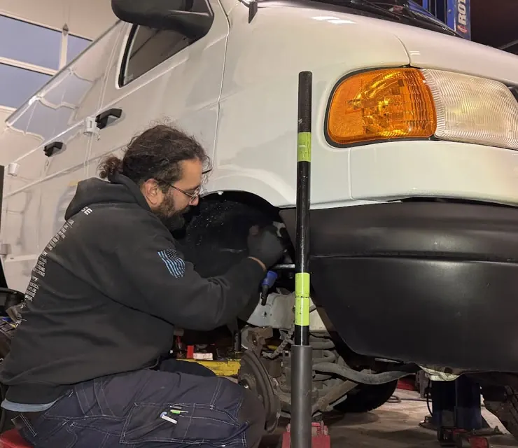 Brake service in progress on a car in a repair shop